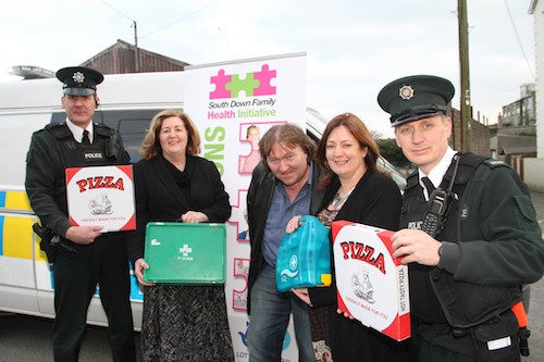 Constable Alex Beck, South Down NPT, Jacinta Linden, Director SDFHI, Councillor Brian Quinn, Allison Slater, Information and Development Officer SDFHI and Constable Stewart Finn, South Down NPT, pictured at the launch of Pizza, Peelers and Plasters.